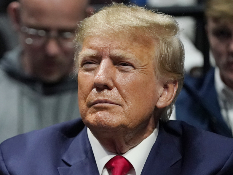 Former President Donald Trump called on his supporters to protest over his social media platform Truth Social last Saturday claiming he will be arrested on bogus charges. (Sue Ogrocki/AP)