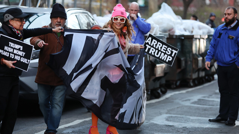 A small group of protesters gathers outside of a Manhattan courthouse after news broke that former President Donald Trump has been indicted by a grand jury on Thursday in New York City, with one pictured carrying a sign that says &quot;arrest Trump.&quot; While the nature of the indictment is unprecedented, Trump isn't the first president — current or former — to face arrest. (Spencer Platt/Getty Images)